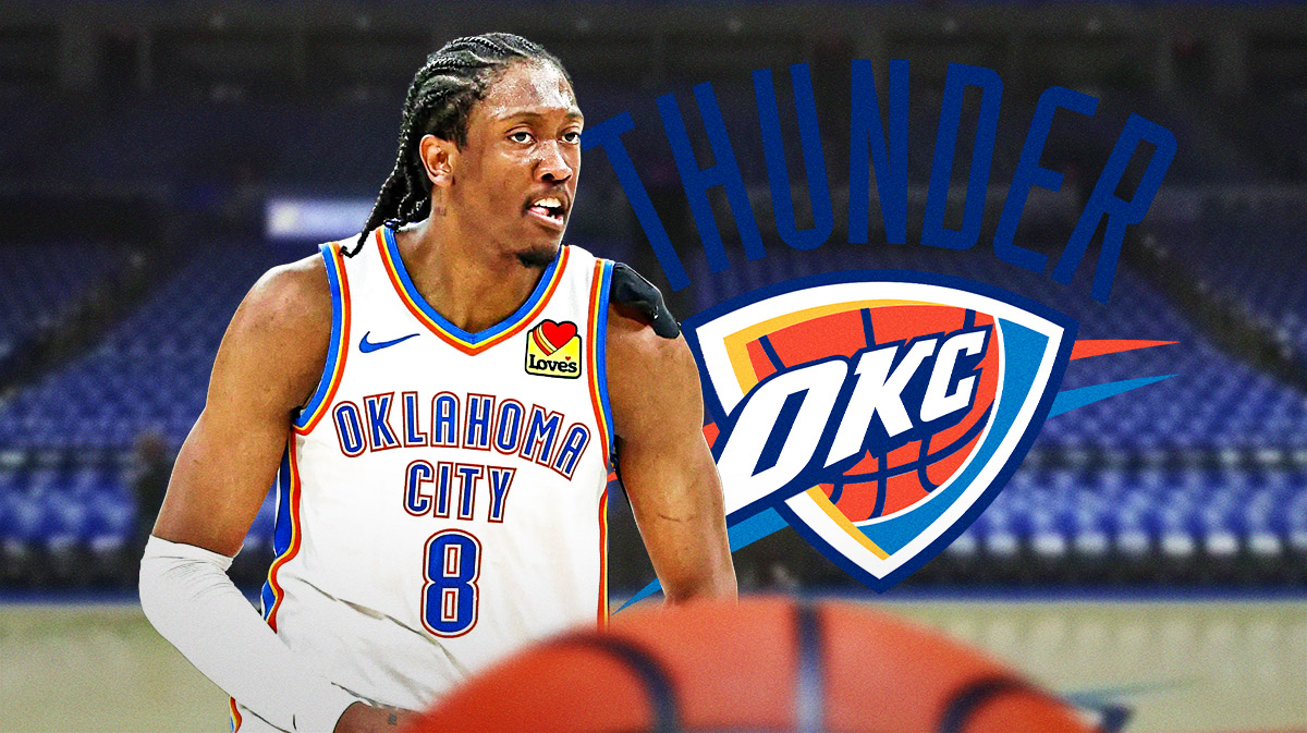 Thunder forward Jalen Williams next to an NBA official with the Thunder logo in the background