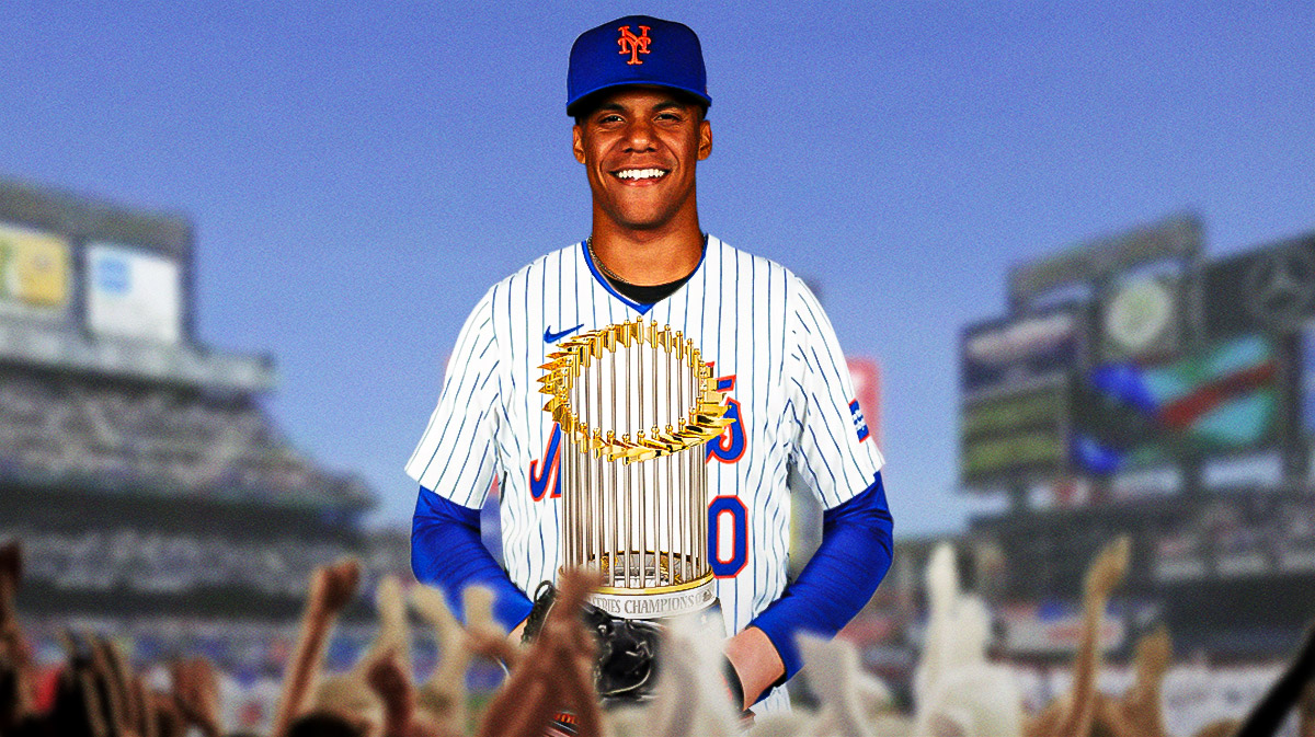 Juan Soto in a Mets uniform holding a World Series trophy