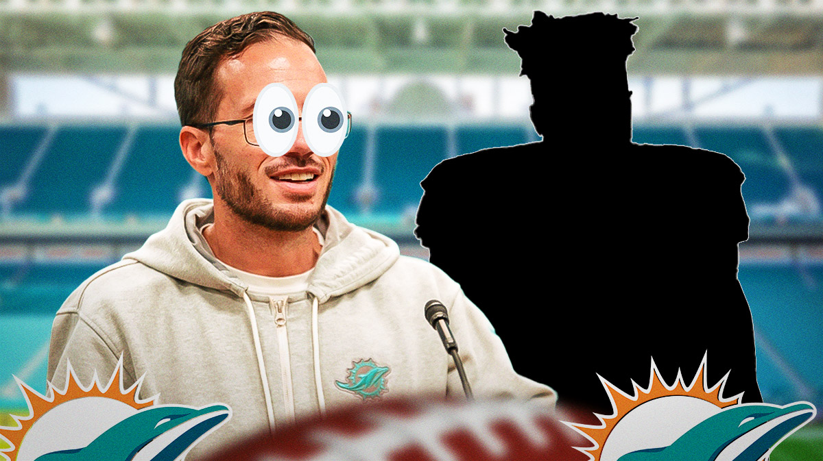 Mike McDaniel (with bulging eyes) looks at silhouette