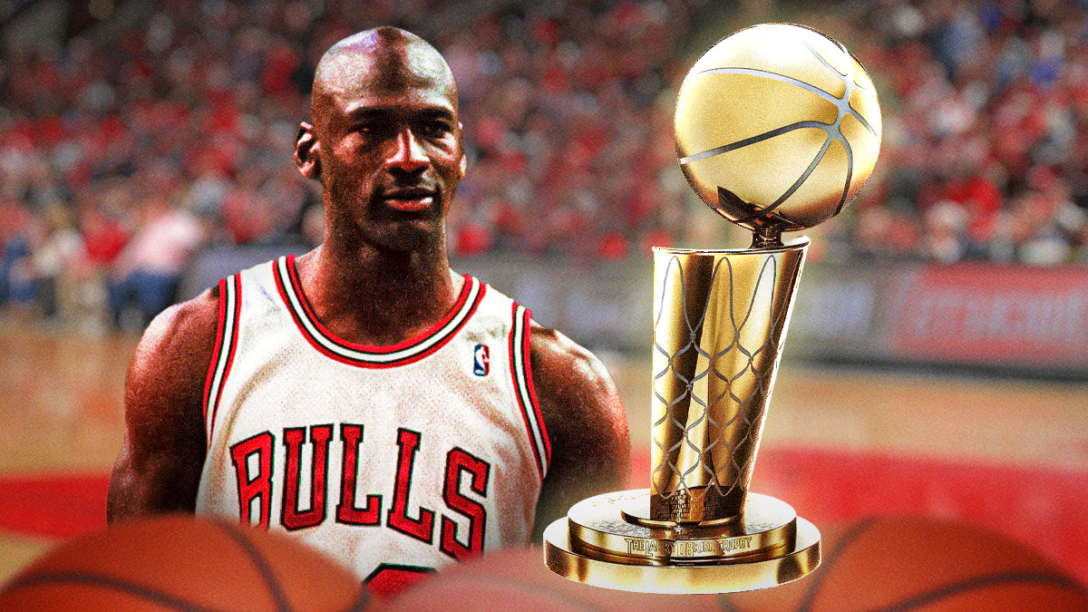Michael Jordan with an NBA championship trophy.