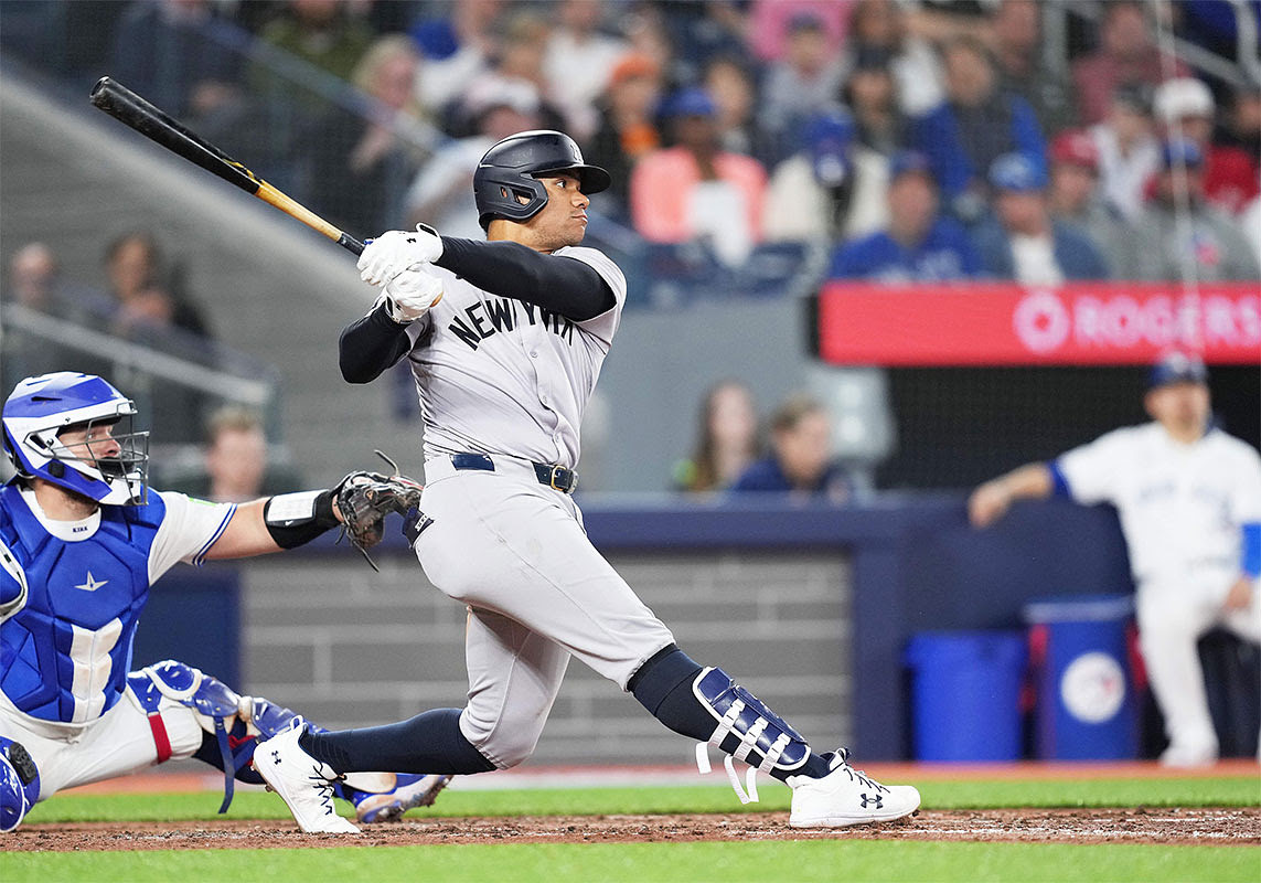 New York Yankees right fielder Juan Soto (22) hits an RBI double against the Toronto Blue Jays during the fifth inning at Rogers Centre.