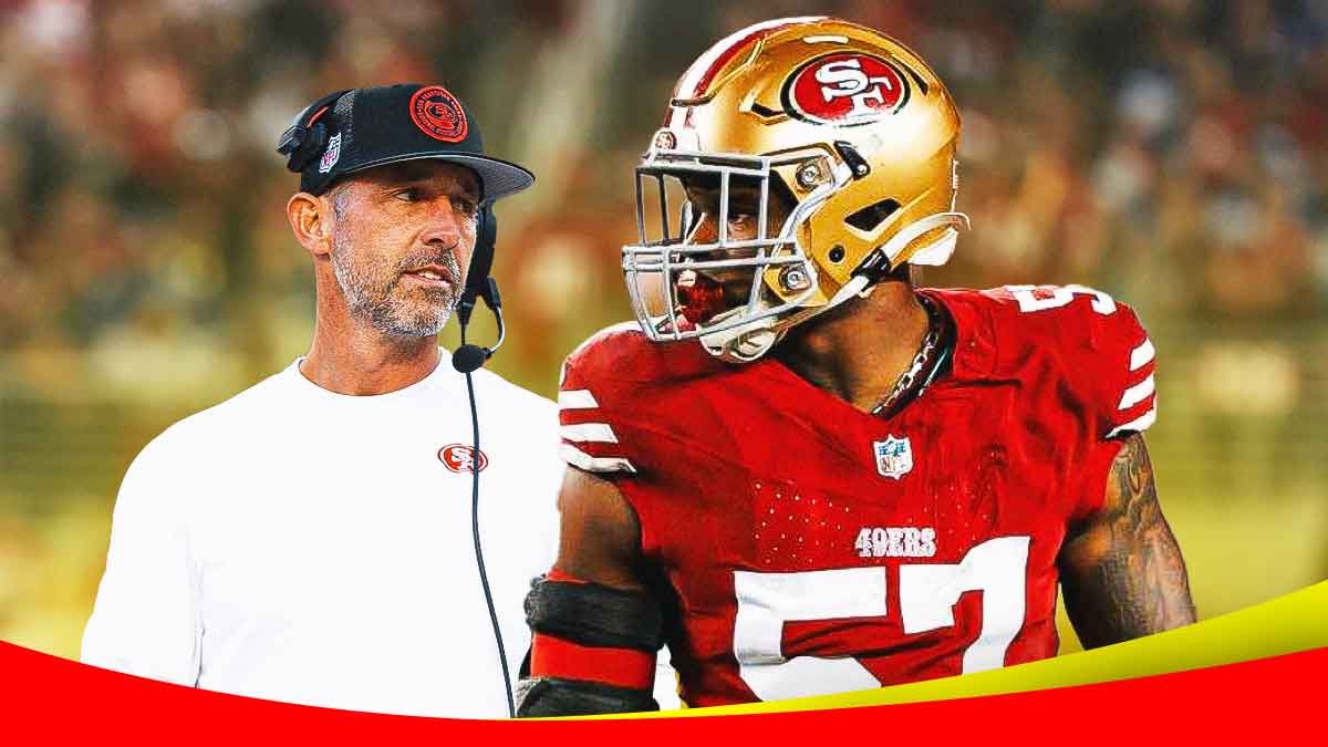 Dre Greenlaw next to Kyle Shanahan in front of the 49ers stadium.