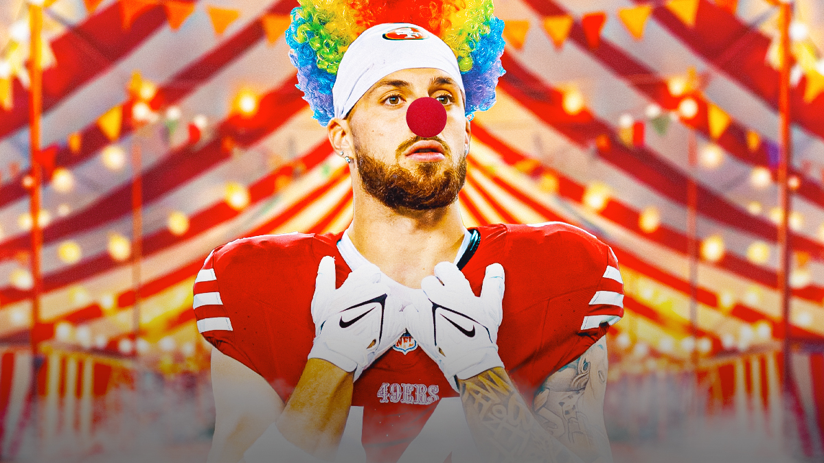 49ers WR Ricky Pearsall standing in front of a circus tent with a clown wig on his head and a red clown nose. He's wearing his normal 49ers uniform, but no helmet.