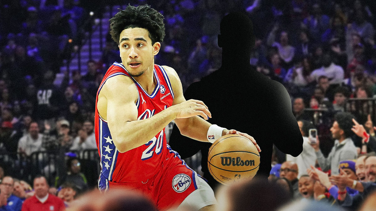 Jared McCain next to the blacked-out silhouette of Jaden Springer on the 76ers court.