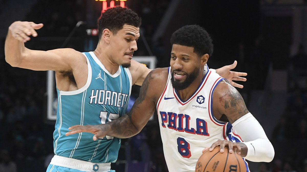 76ers forward Paul George drives past Hornets' Josh Green