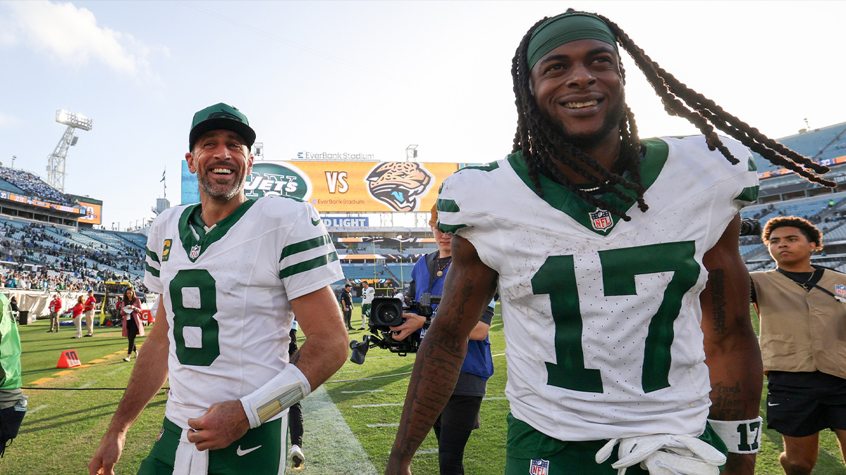 New York Jets quarterback Aaron Rodgers (8) and wide receiver Davante Adams (17) celebrates after beating the Jacksonville Jaguars at EverBank Stadium.
