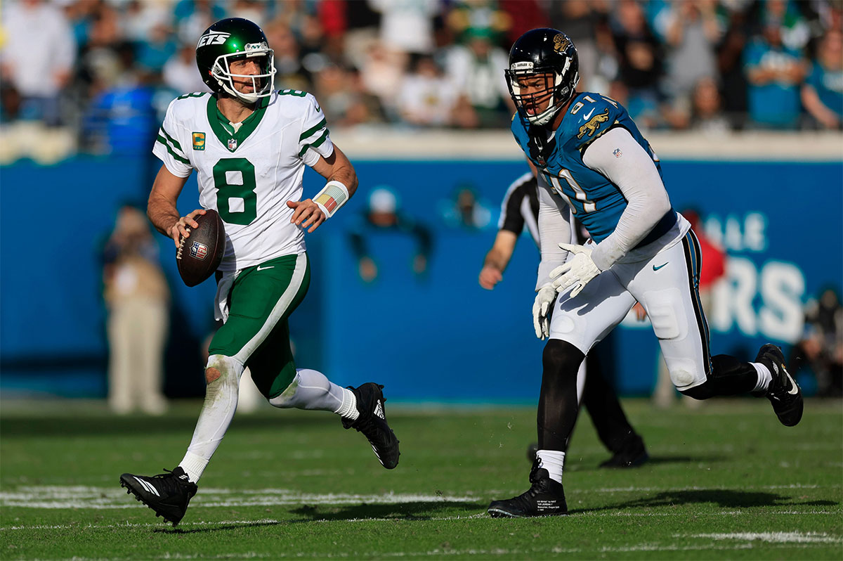 New York Jets quarterback Aaron Rodgers (8) looks on before an NFL football matchup Sunday, Dec. 15, 2024 at EverBank Stadium in Jacksonville, Fla. [Corey Perrine/Florida Times-Union]