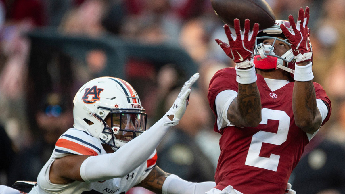 Alabama Crimson Tide wide receiver Ryan Williams (2) drops a pass guarded by Auburn Tigers defensive back Jay Crawford (23) as Auburn Tigers take on Alabama Crimson Tide at Bryant-Denny Stadium in Tuscaloosa, Ala., on Saturday, Nov. 30, 2024. Alabama Crimson Tide leads Auburn Tigers 14-6 at halftime.