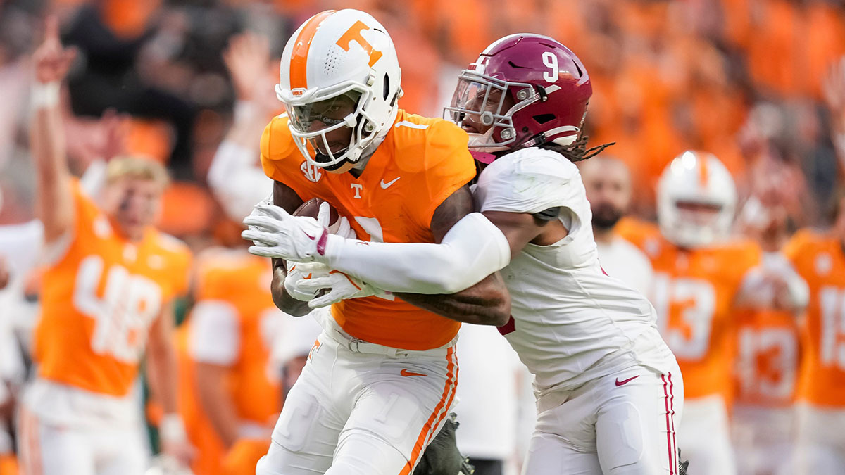 Tennessee wide receiver Dont'e Thornton Jr. (1) tries to escape a tackle by Alabama defensive back Jaylen Mbakwe (9) after making a catch during an SEC conference game between Tennessee and Alabama in Neyland Stadium on Saturday, Oct. 19, 2024.