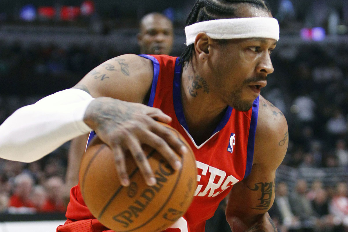 Philadelphia 76ers guard Allen Iverson (3) dribbles the ball during the first half at the United Center.