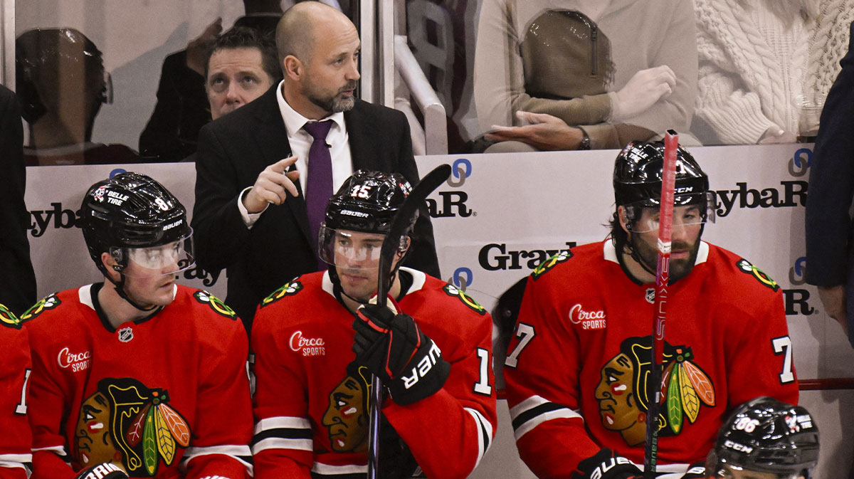 Chicago Blackhawks’ interim head coach Anders Sorensen, center, directs the team in his debut against the Winnipeg Jets, during the third period at the United Center with his team against the Winnipeg jets.