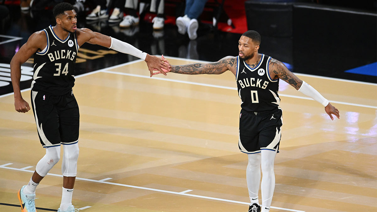 Milwaukee Bucks guard Damian Lillard (0) and forward Giannis Antetokounmpo (34) react during the fourth quarter against the Atlanta Hawks in a semifinal of the 2024 Emirates NBA Cup at T-Mobile Arena.