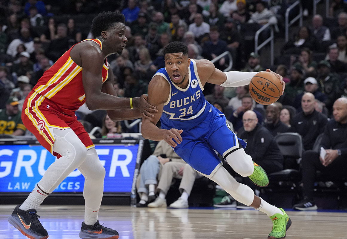 Milwaukee Bucks forward Giannis Antetokounmpo (34) drives to the basket against Atlanta Hawks center Clint Capela (15) in the first half at Fiserv Forum.