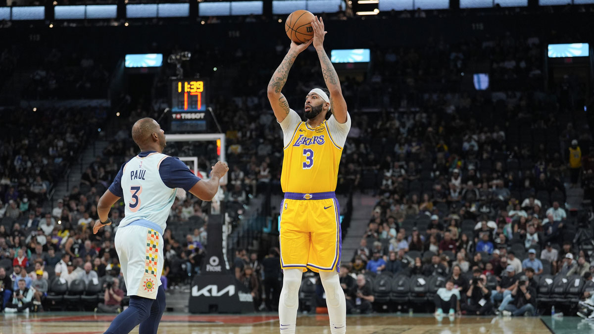 Los Angeles Lakers forward Anthony Davis (3) shoots over San Antonio Spurs guard Chris Paul (3) in the second half at Frost Bank Center.