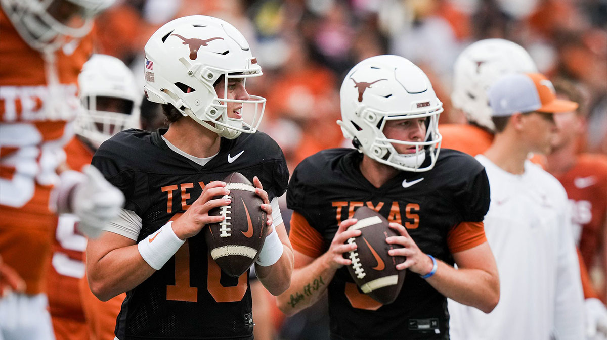 Texas Longhorns quarterbacks Arch Manning (16), left, and Quinn Ewers (3) throw passes while warming up ahead of the Longhorns' spring Orange and White game