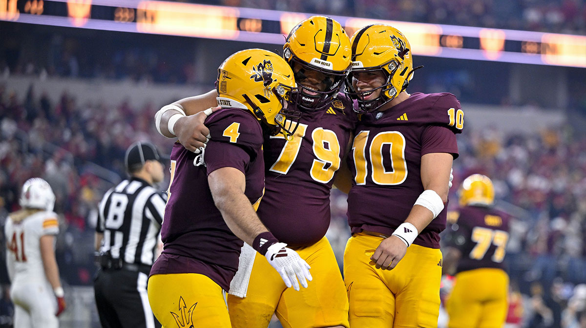 Arizona State Sun Devils running back Cam Skattebo (4) and offensive lineman Leif Fautanu (79) and quarterback Sam Leavitt (10) celebrate after Skattebo scores a rushing touchdown against the Iowa State Cyclones during the second half at AT&T Stadium.