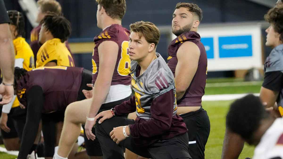Arizona State quarterback Sam Leavitt (left) and running back Cam Skattebo stretch during open media availability at the Georgia Tech practice facility on Monday, Dec. 30, 2024. They will play Texas in the Chick-fil-A Peach Bowl on Jan. 1, 2024.