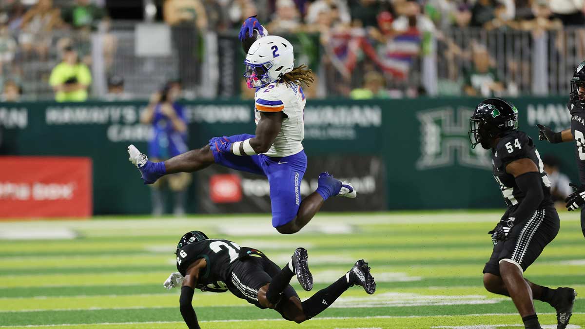 Boise State Broncos running back Ashton Jeanty (2) leaps over Hawaii Rainbow Warriors defensive back Deliyon Freeman (26) during the second quarter at Clarence T.C. Ching Athletics Complex. The play was called back due to a Broncos foul.