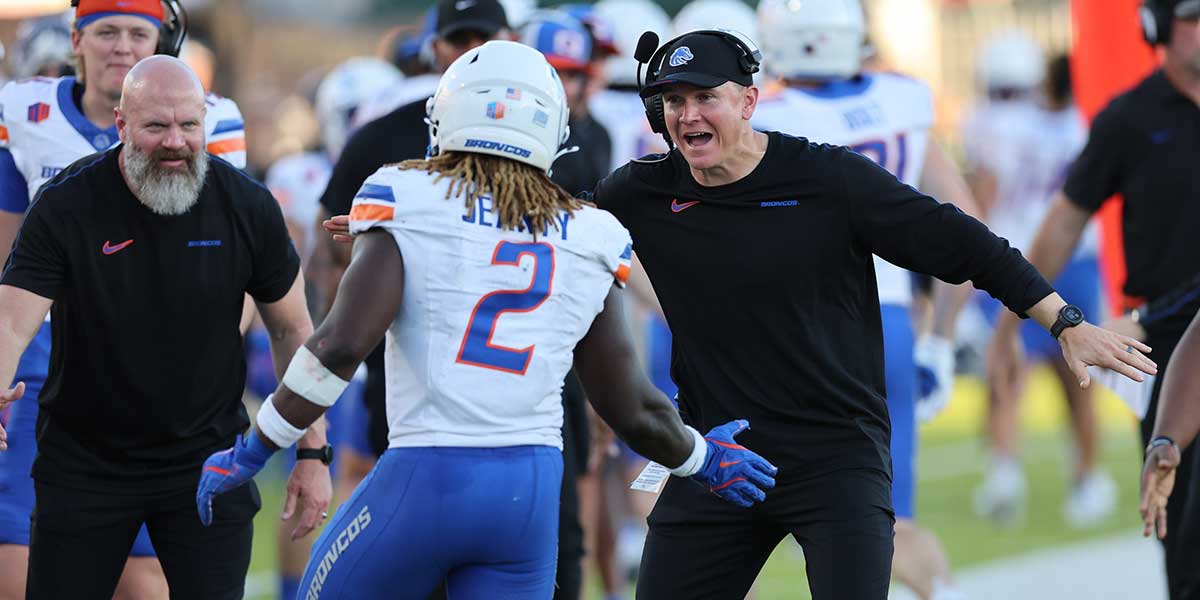 Boise State Broncos head coach Spencer Danielson reacts with running back Ashton Jeanty (2) after scoring a touchdown during the first quarter against the Hawaii Rainbow Warriors at Clarence T.C. Ching Athletics Complex.