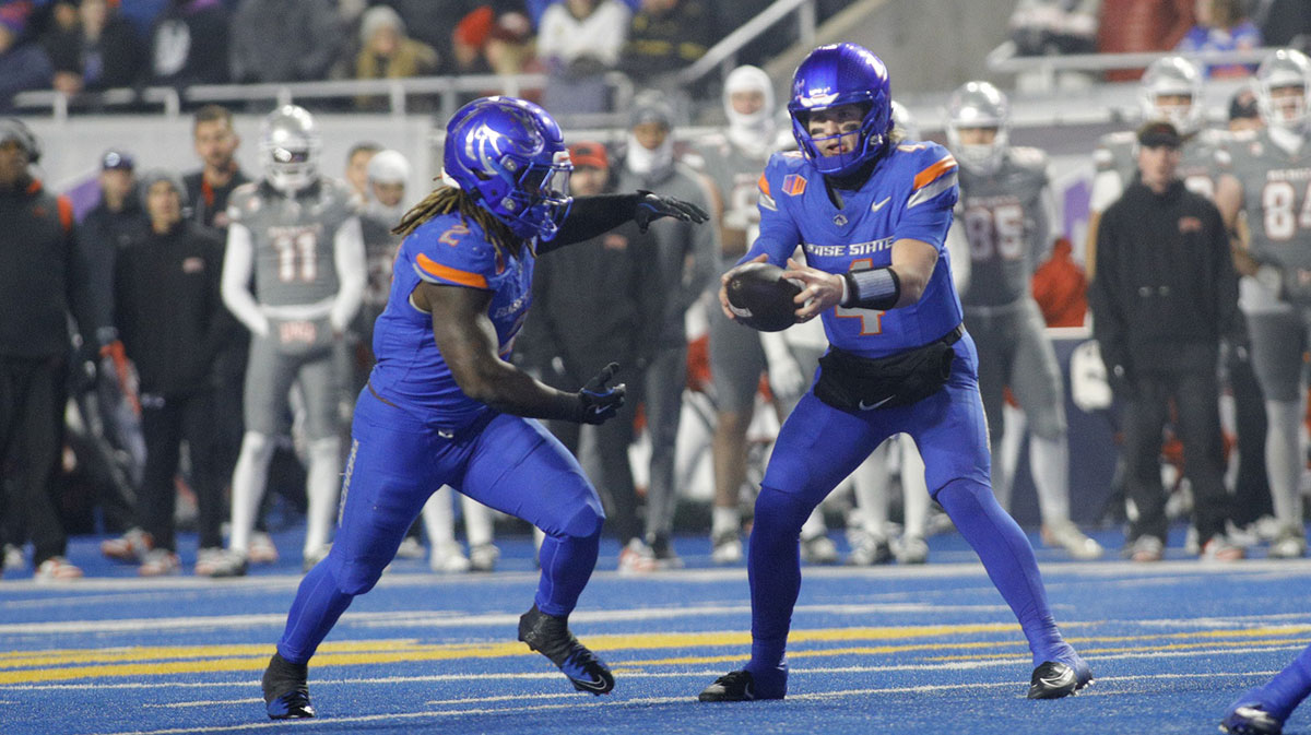 Boise State Broncos quarterback Maddux Madsen (4) hands off to running back Ashton Jeanty (2) during the first half against UNLV Rebels at Albertsons Stadium.