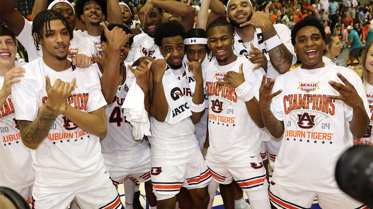 The Auburn Tigers react after defeating the Memphis Tigers in Lahaina Civic Center.