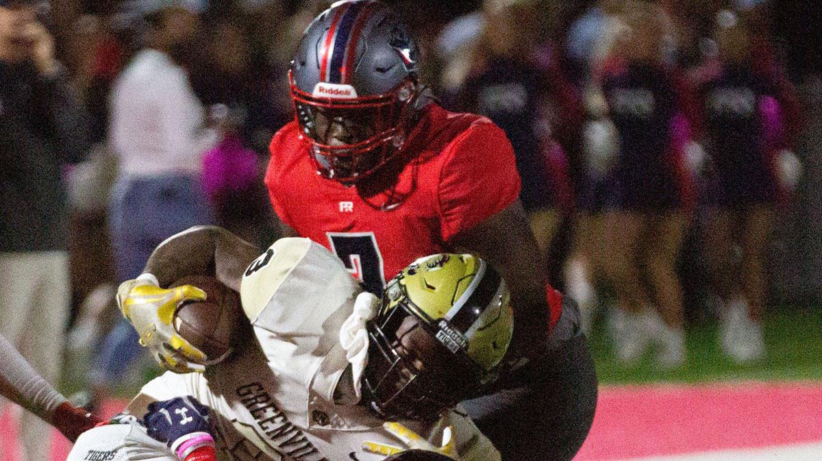 Greenville's Laquan Robinson (3) tries to twist out of a tackle by Pike Road's Tre'marcus Webb (2) on October 22, 2021. 1022 Pike Road Vs Greenville.
