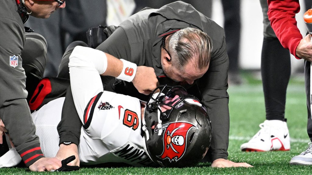 Tampa Bay Buccaneers quarterback Baker Mayfield (6) recieves attention after being sacked in the third quarter at Bank of America Stadium.