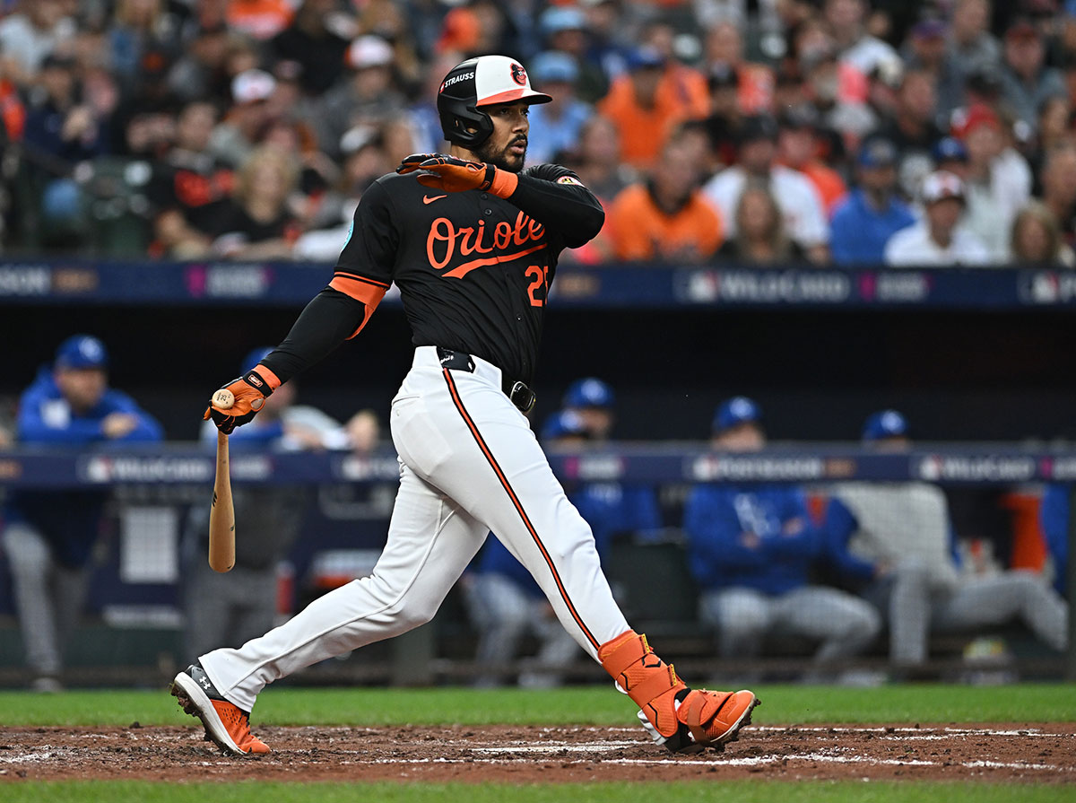 Baltimore Orioles outfielder Anthony Santander (25) hits a single in the fourth inning against the Kansas City Royals in game two of the Wild Card round for the 2024 MLB Playoffs at Oriole Park at Camden Yards.