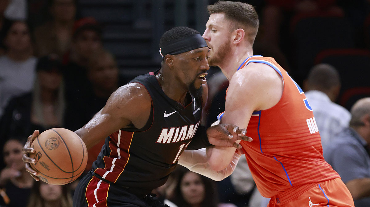 Oklahoma City Thunder center Isaiah Hartenstein (55) defends Miami Heat center Bam Adebayo (13) during the first half at Kaseya Center.