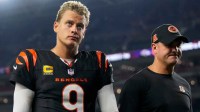 Cincinnati Bengals quarterback Joe Burrow (9) and head coach Zac Taylor head for the locker room after the fourth quarter of the NFL Week 3 game between the Cincinnati Bengals and the Washington Commanders at Paycor Stadium in downtown Cincinnati on Monday, Sept. 23, 2024. The Bengals remain winless after a 38-33 loss to Washington.