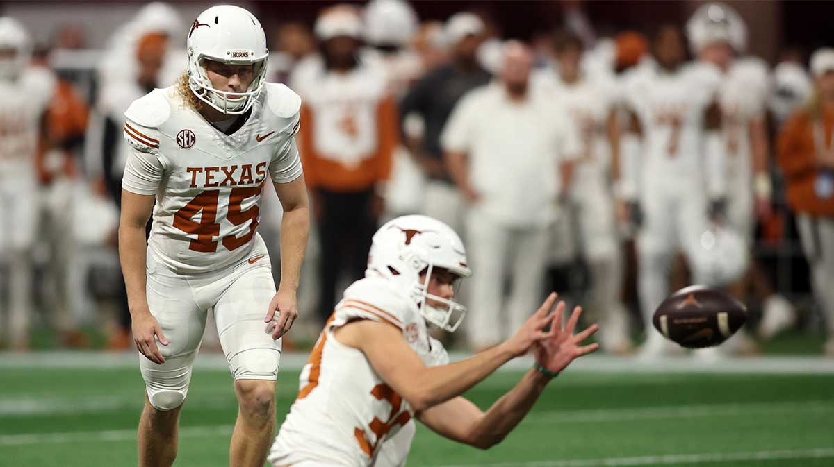 Texas Longhorns place kicker Bert Auburn (45) kicks a field goal against the Georgia Bulldogs during the first half in the 2024 SEC Championship game at Mercedes-Benz Stadium.