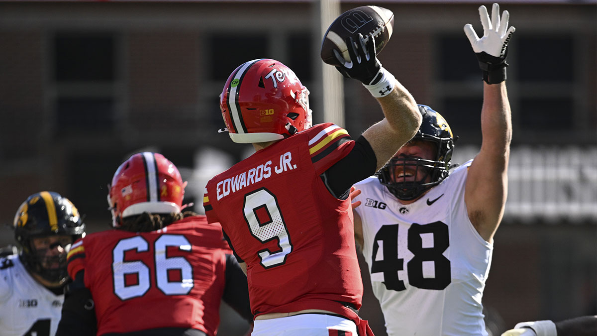 Maryland Terrapins quarterback Billy Edwards Jr. (9)] throws as Iowa Hawkeyes defensive lineman Max Llewellyn (48) applies pressure during the first half at SECU Stadium.