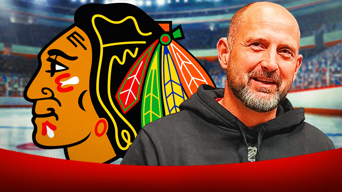 Anders Sorensen looking happy, Chicago Blackhawks logo, hockey rink in background