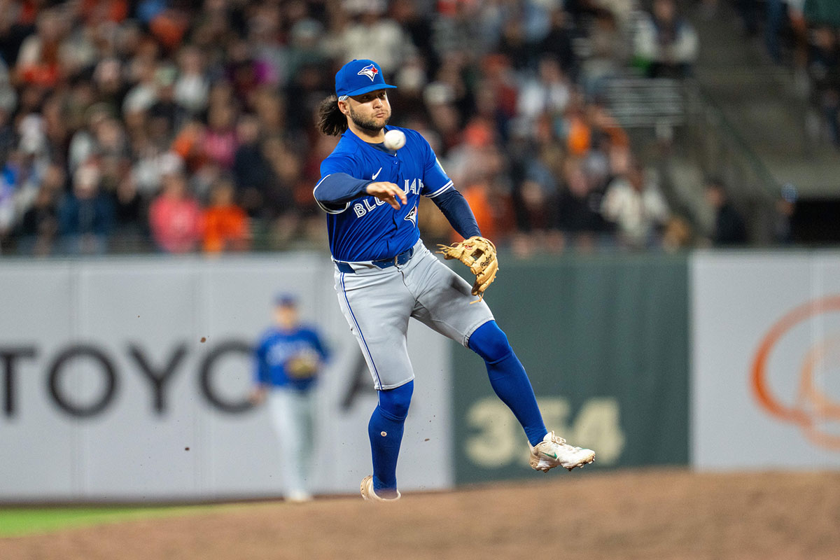 Toronto Blue Jays shortstop Bo Bichette (11) throws out San Francisco Giants first baseman Wilmer Flores (41) during the ninth inning at Oracle Park.