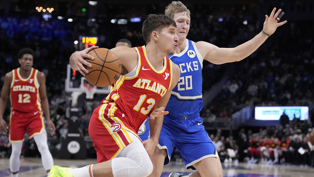 Atlanta Hawks guard Bogdan Bogdanovic (13) drives to the basket against Milwaukee Bucks guard AJ Green (20) during the second half at Fiserv Forum.