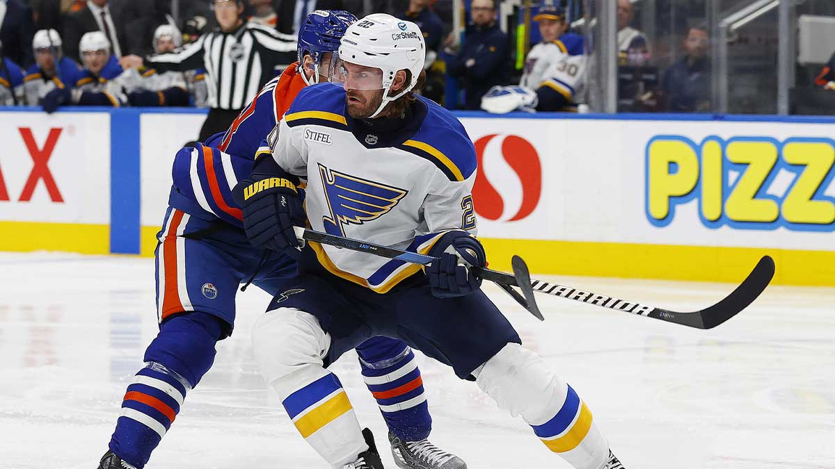 St. Louis Blues forward Brandon Saad (20) and Edmonton Oilers forward Zach Hyman (18) battle for position during the second period at Rogers Place.