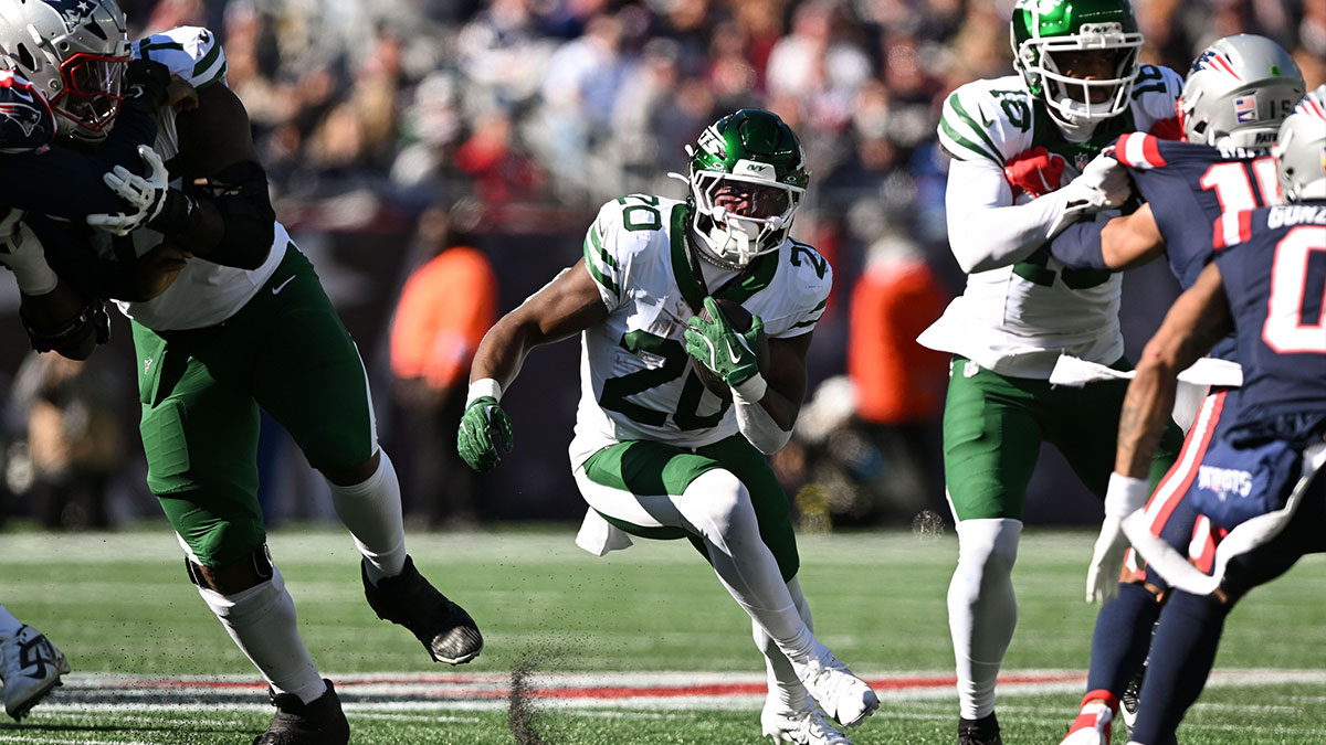 New York Jets running back Breece Hall (20) rushes against the New England Patriots during the first half at Gillette Stadium.