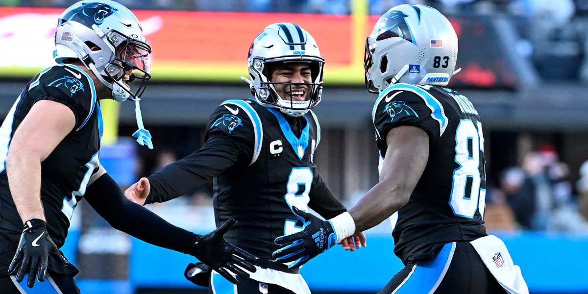 Carolina Panthers quarterback Bryce Young (9) reacts with wide receiver Adam Thielen (19) and wide receiver David Moore (83) after Moores touchdown catch in the fourth quarter at Bank of America Stadium.