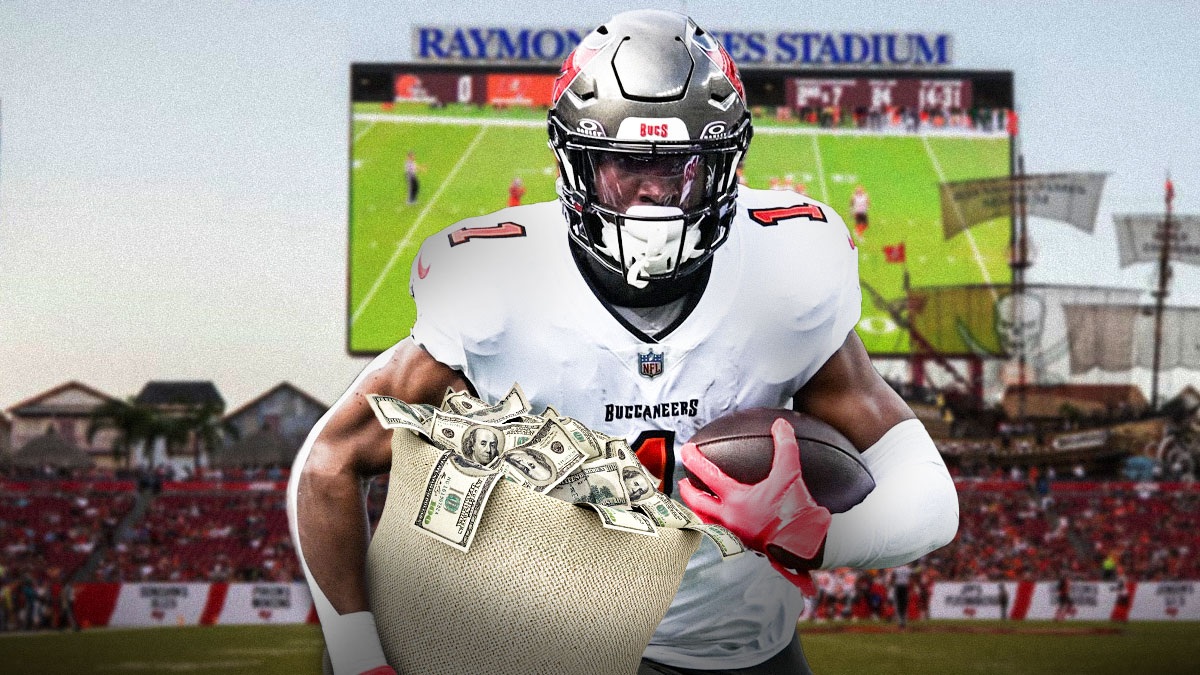 Rachaad White in a Tampa Bay Buccaneers uniform holding a bag of money as the NFL fined White while he played in place of bucky irving as the nfl fines continue.