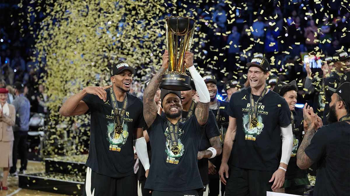 Bucks guard Damian Lillard (0) and center Brook Lopez (11) celebrate after winning the Emirates NBA Cup championship game against the Oklahoma City Thunder at T-Mobile Arena