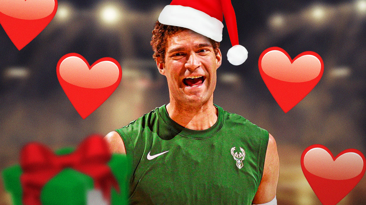 Brook Lopez with a santa hat on. Hearts all around him.