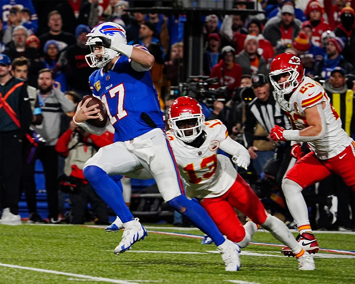 Bills quarterback Josh Allen avoids Kansas City's Nazeeh Johnson and Drue Tranquill on his late fourth quarter touchdown carry into the end zone in Orchard Park, Nov.17, 2024.