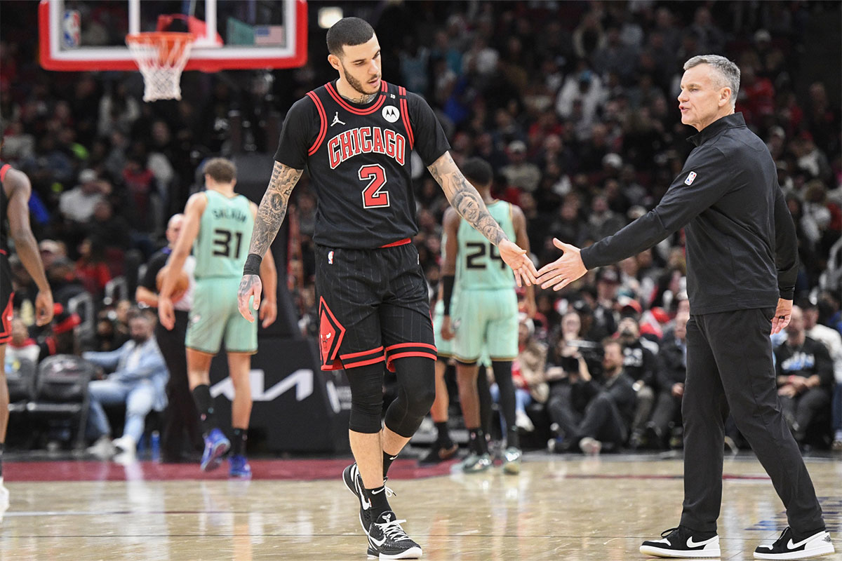 Lonzo Ball (2) high-fives Chicago Bulls coach Billy Donovan during the second half against the Charlotte Hornets at the United Center