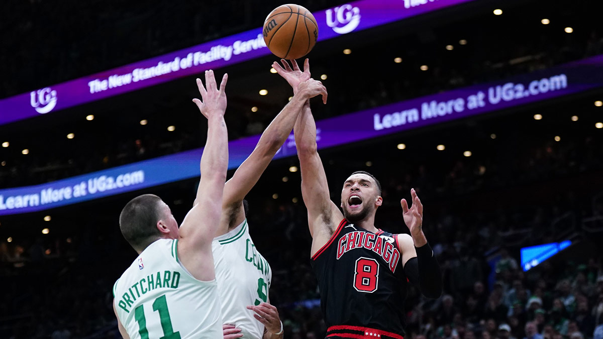 Bulls guard Zach LaVine shoots against Boston Celtics guard Derrick White and guard Payton Pritchard