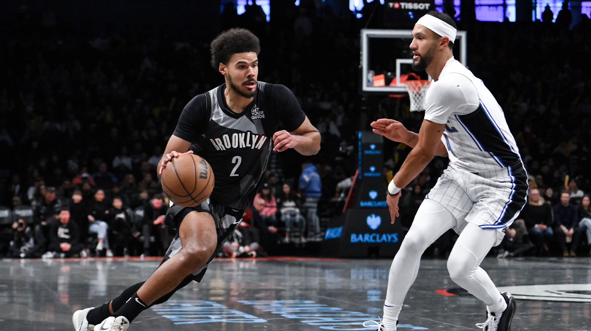 Brooklyn Nets forward Cameron Johnson (2) drives to the basket while being defended by Orlando Magic guard Jalen Suggs (4) during the second half at Barclays Center.