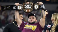 Arizona State Sun Devils running back Cam Skattebo (4) holds up the WWE Big 12 championship belt after the Sun Devils defeat the Iowa State Cyclones and win the 2024 Big 12 Championship at AT&T Stadium.