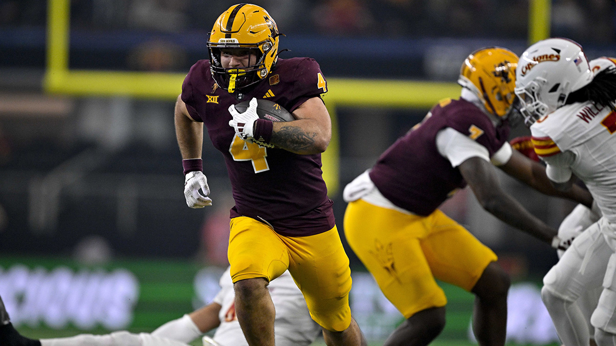 Arizona State Sun Devils running back Cam Skattebo (4) scores a rushing touchdown against the Iowa State Cyclones during the second half at AT&T Stadium.