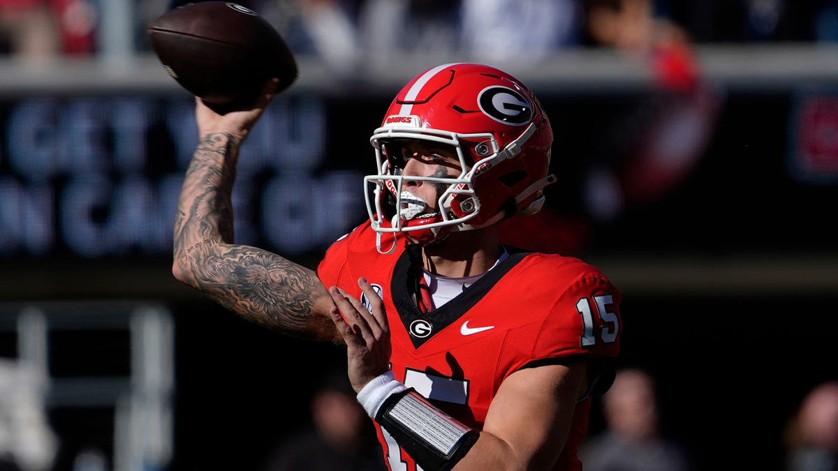 Georgia quarterback Carson Beck (15) throws a pass during the first half of a NCAA college football game against Massachusetts in Athens, Ga.