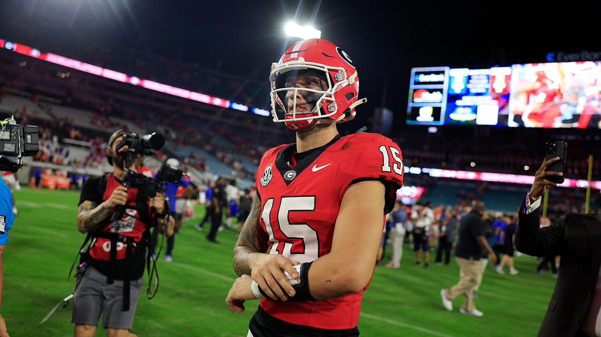 Caption: Georgia Bulldogs quarterback Carson Beck (15) walks off the field after the game of an NCAA college football matchup Saturday, Nov. 2, 2024
