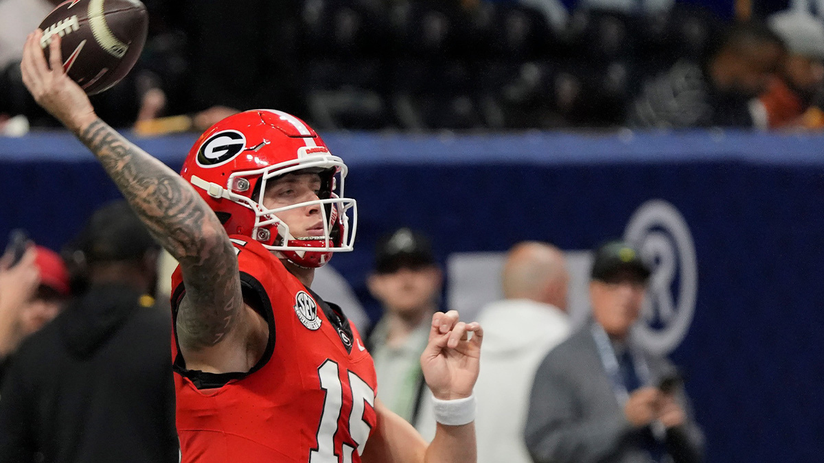 Georgia quarterback Carson Beck (15) warms up before the start of the SEC championship game against Texas
